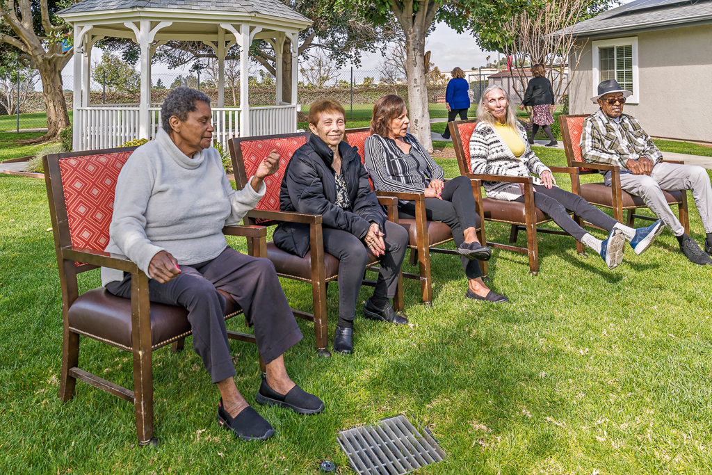 residents outside sitting in chairs